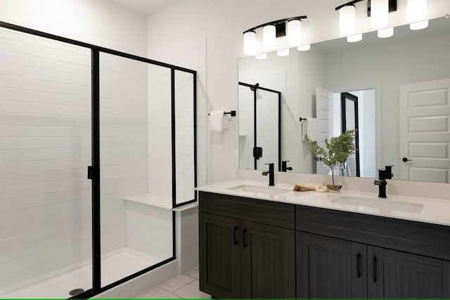 bathroom with tile patterned flooring, vanity, and an enclosed shower