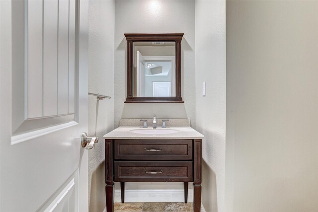 bathroom with tile patterned floors and vanity