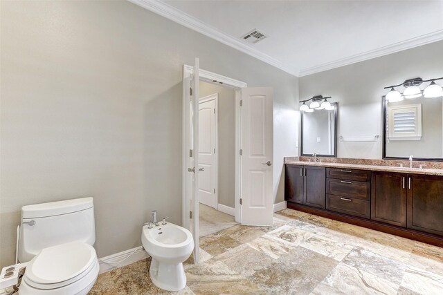 bathroom featuring a bidet, tile patterned floors, toilet, crown molding, and double sink vanity