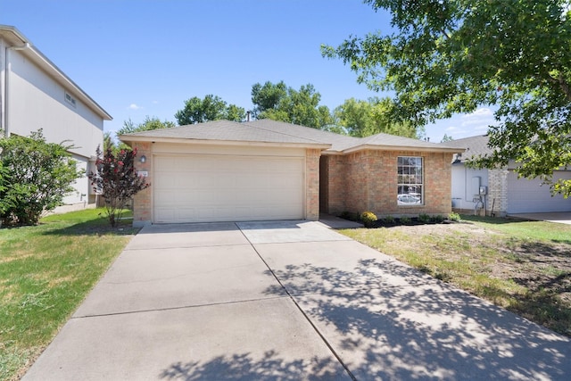 ranch-style house featuring a garage and a front lawn