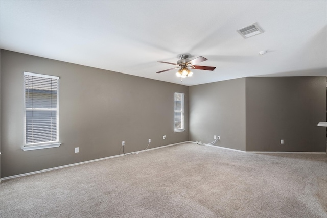 carpeted empty room featuring ceiling fan