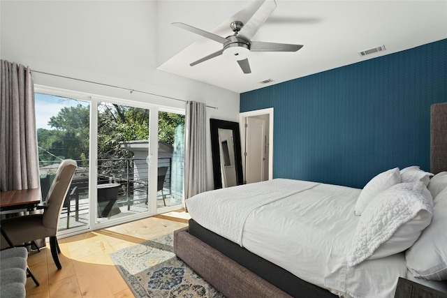 bedroom with ceiling fan, access to outside, and light hardwood / wood-style floors