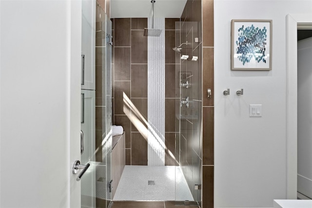 bathroom with a shower with shower door