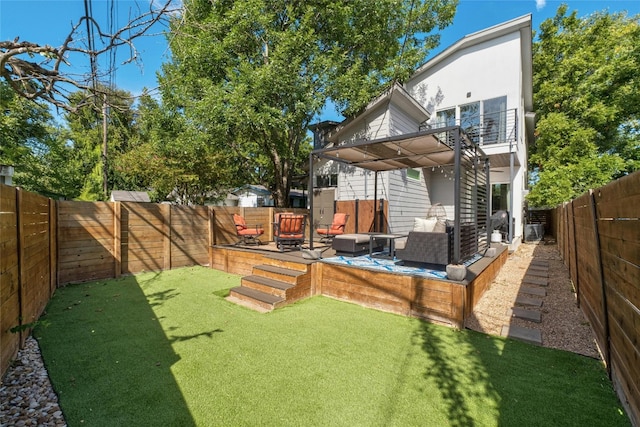 view of yard with an outdoor living space, a pergola, and a patio area