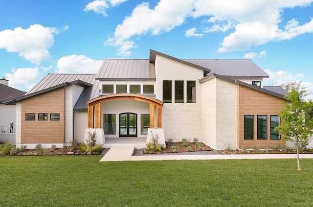 rear view of house with a lawn