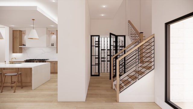 staircase featuring wood-type flooring