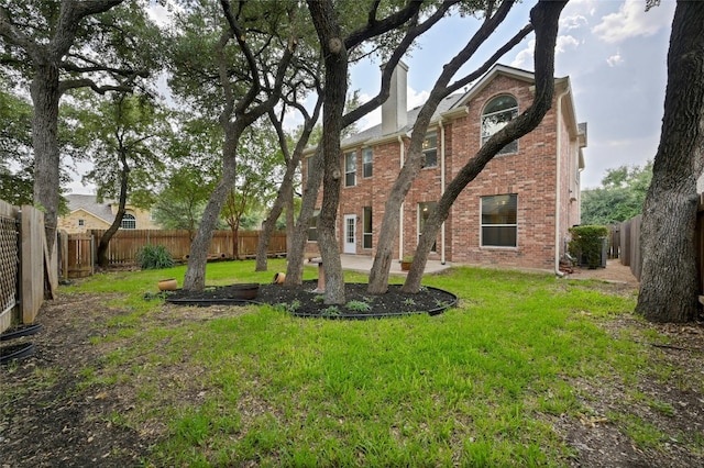 view of yard featuring a patio and a fenced backyard