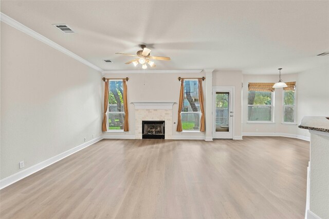 unfurnished living room featuring crown molding, light hardwood / wood-style floors, and ceiling fan