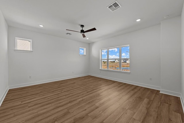 empty room featuring light wood-type flooring and ceiling fan