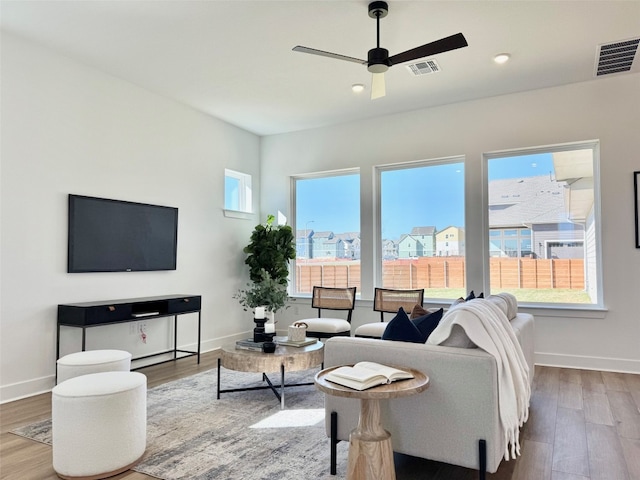 living room featuring wood finished floors and visible vents