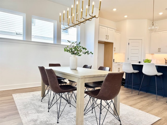 dining area with recessed lighting, baseboards, and light wood-type flooring