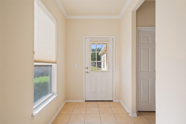 entryway with light tile patterned floors and ornamental molding