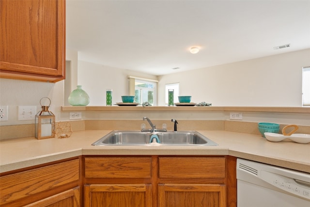 kitchen with sink, kitchen peninsula, and dishwasher