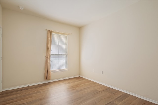 empty room featuring hardwood / wood-style floors and a healthy amount of sunlight