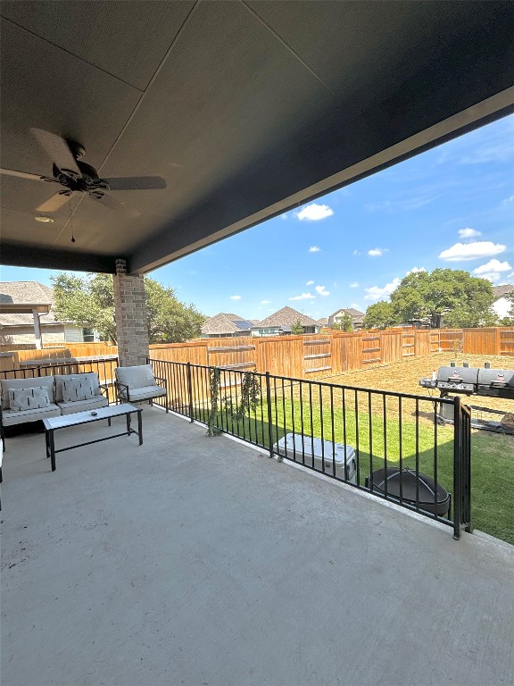 view of patio / terrace featuring ceiling fan and a grill