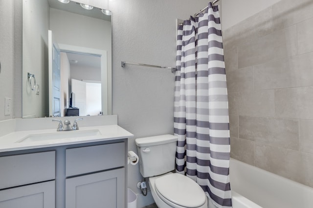 full bathroom featuring vanity, toilet, and shower / tub combo with curtain