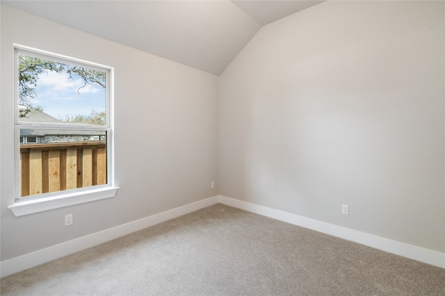 unfurnished room with a wealth of natural light and carpet