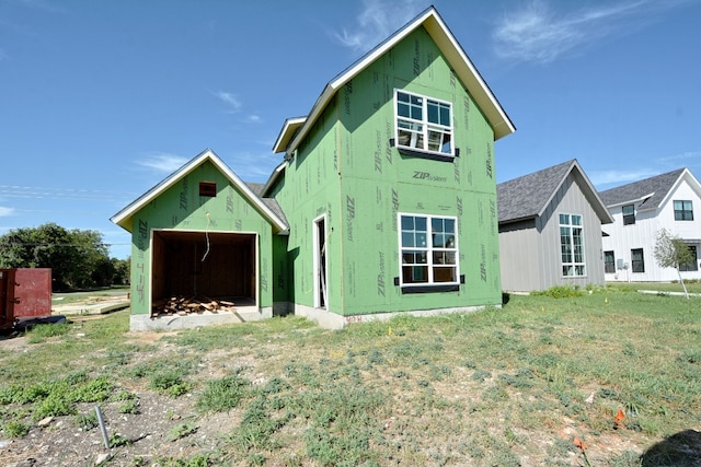 back of house with a yard