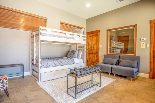 bedroom featuring light tile patterned flooring