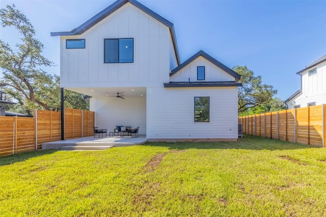 back of house featuring board and batten siding, a fenced backyard, a patio, and ceiling fan