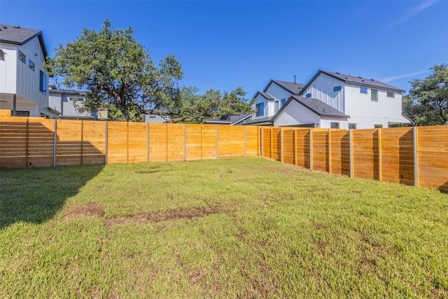 view of yard featuring a fenced backyard