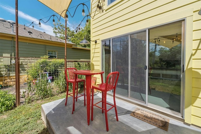 view of patio / terrace featuring fence