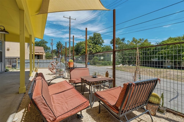 view of patio / terrace featuring outdoor dining area and fence