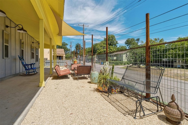 view of patio / terrace featuring fence