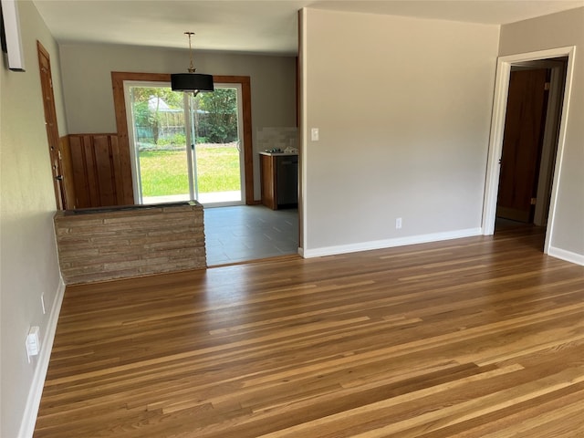 spare room with hardwood / wood-style flooring