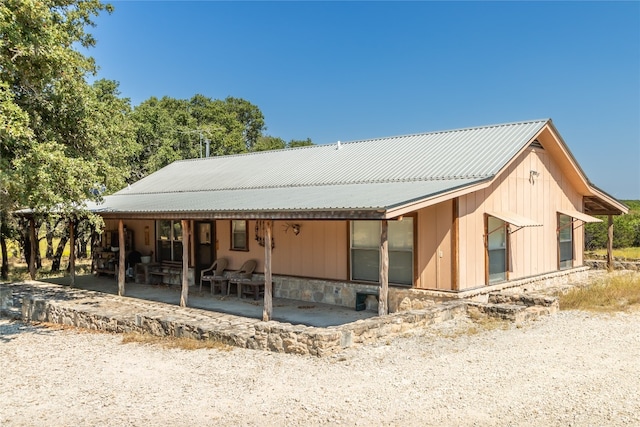 rear view of house featuring a patio