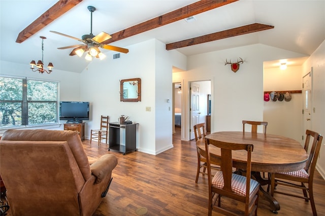 dining space featuring ceiling fan with notable chandelier, vaulted ceiling with beams, and dark hardwood / wood-style floors