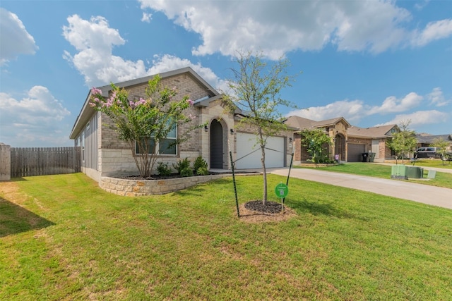 view of front of property with a front yard and a garage