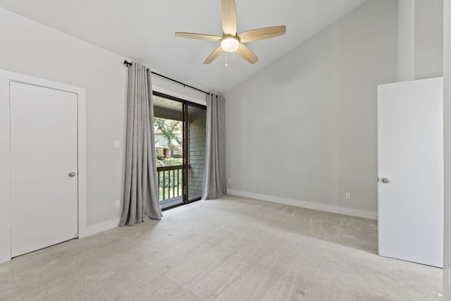 empty room featuring a ceiling fan, light carpet, high vaulted ceiling, and baseboards