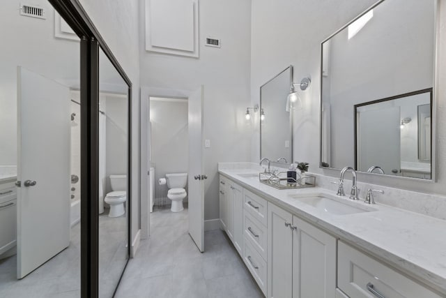 bathroom with visible vents, a sink, and toilet