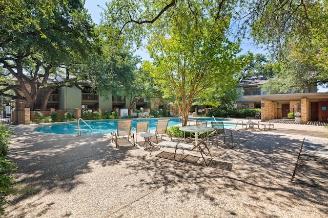 view of swimming pool with a patio