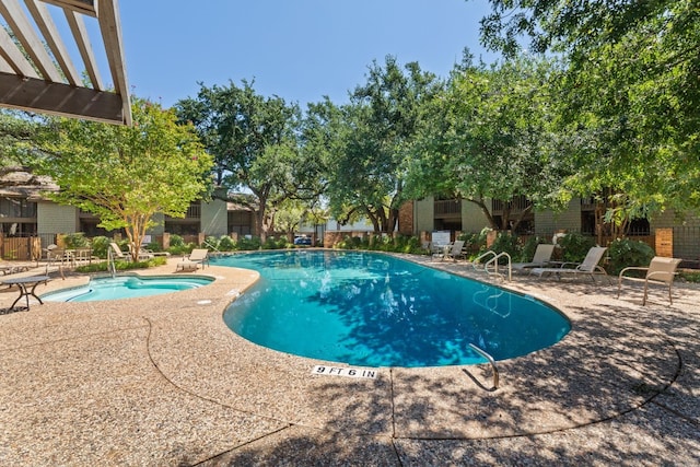 view of pool featuring a patio