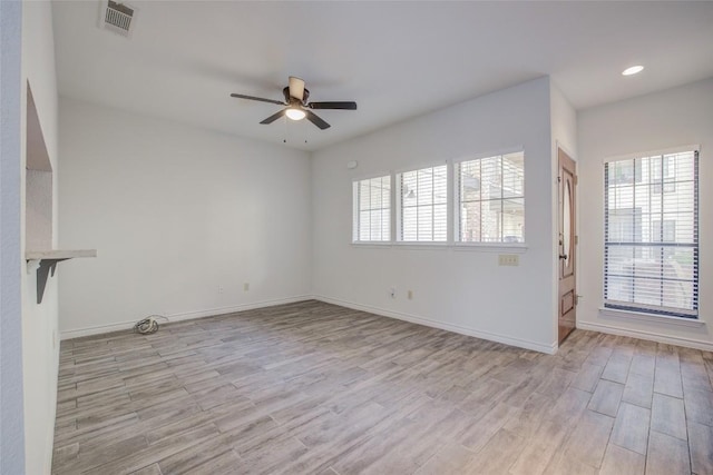 3001 Cedar St Unit A-116, Austin, TX 78705 - unfurnished living room featuring a ceiling fan, wood finished floors, and recessed lighting