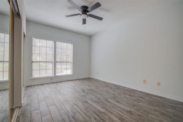 3001 Cedar St Unit A-116, Austin, TX 78705 - empty room with wood finished floors and ceiling fan