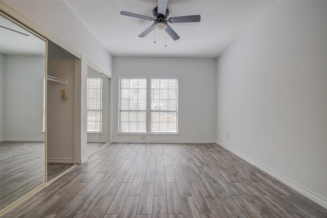 3001 Cedar St Unit A-116, Austin, TX 78705 - unfurnished bedroom with wood finished floors and ceiling fan
