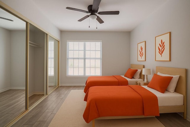 3001 Cedar St Unit A-116, Austin, TX 78705 - bedroom featuring wood finished floors and a ceiling fan