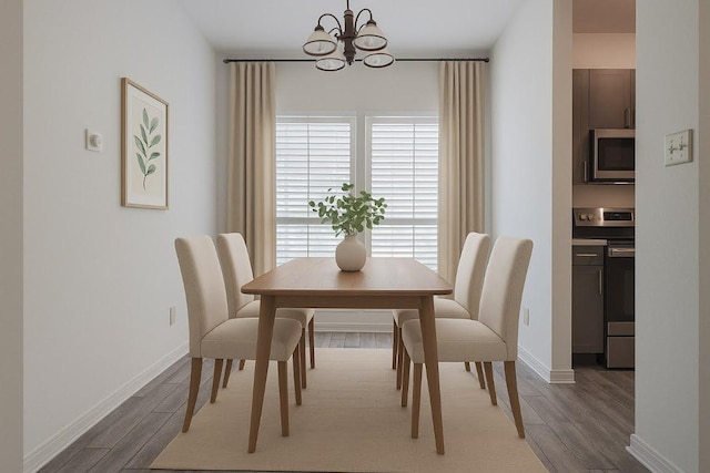3001 Cedar St Unit A-116, Austin, TX 78705 - dining area with a chandelier and wood finished floors