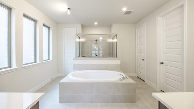 bathroom with vanity, independent shower and bath, and tile patterned flooring