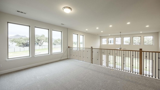 carpeted empty room with a mountain view