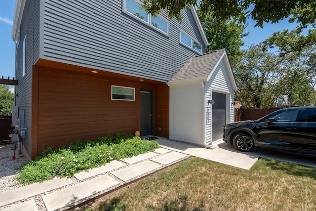 doorway to property with a garage