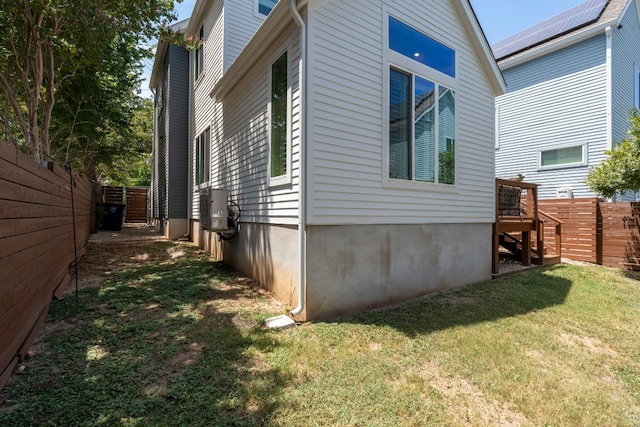 view of home's exterior featuring a yard