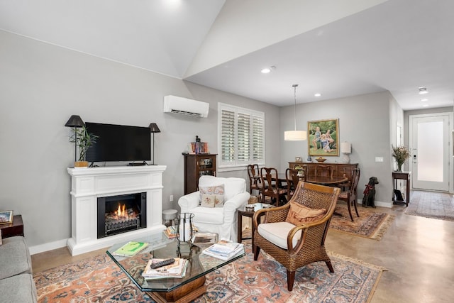 living room featuring a wall mounted AC, vaulted ceiling, and concrete floors