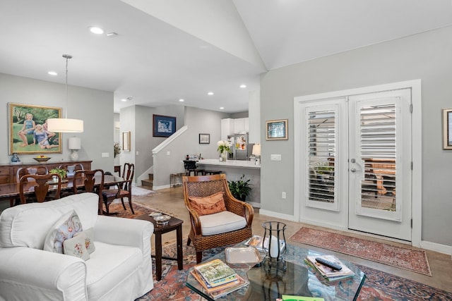 tiled living room featuring french doors and lofted ceiling