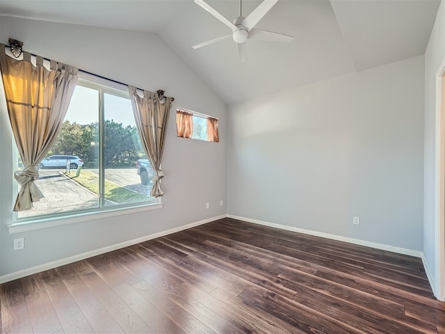 empty room featuring ceiling fan, lofted ceiling, and dark wood-type flooring