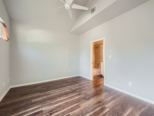 spare room featuring vaulted ceiling, ceiling fan, and dark hardwood / wood-style floors