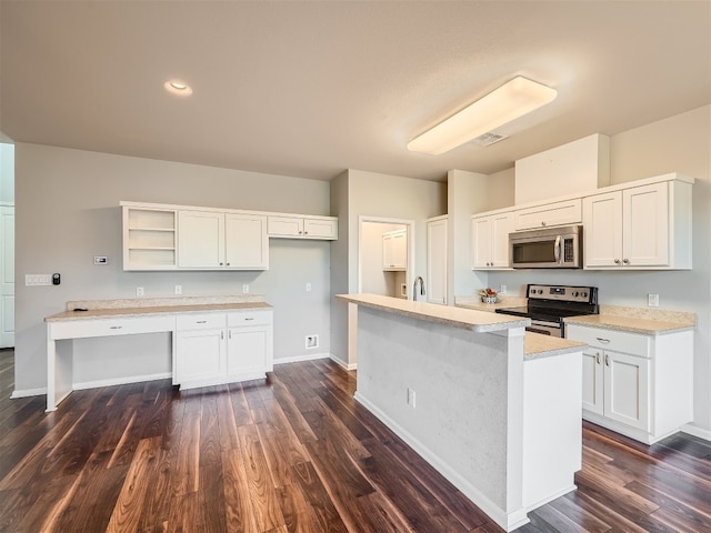 kitchen featuring a center island, dark hardwood / wood-style flooring, white cabinetry, and appliances with stainless steel finishes